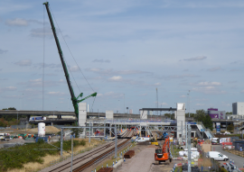 Photo of the new Meridian Water station being constructed (with large crane in shot) in 2018. Railfuture supported closure of the barely-used nearby Angel Road station, which it effectivey replaces