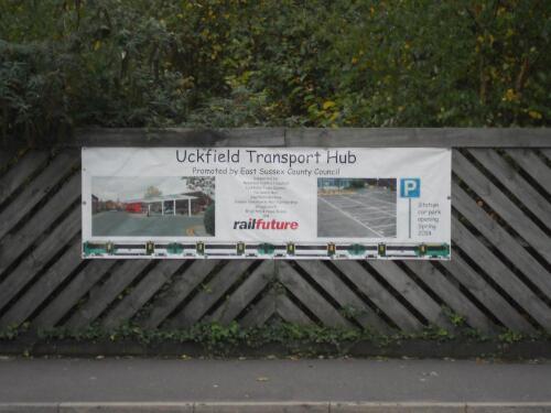 Close-up photo of the Railfuture banner fixed to the fence at Uckfield station to promote Railfuture's campaign to reopen the Uckfield-Lewes railway line. Photo by Chris Page for Railfuture